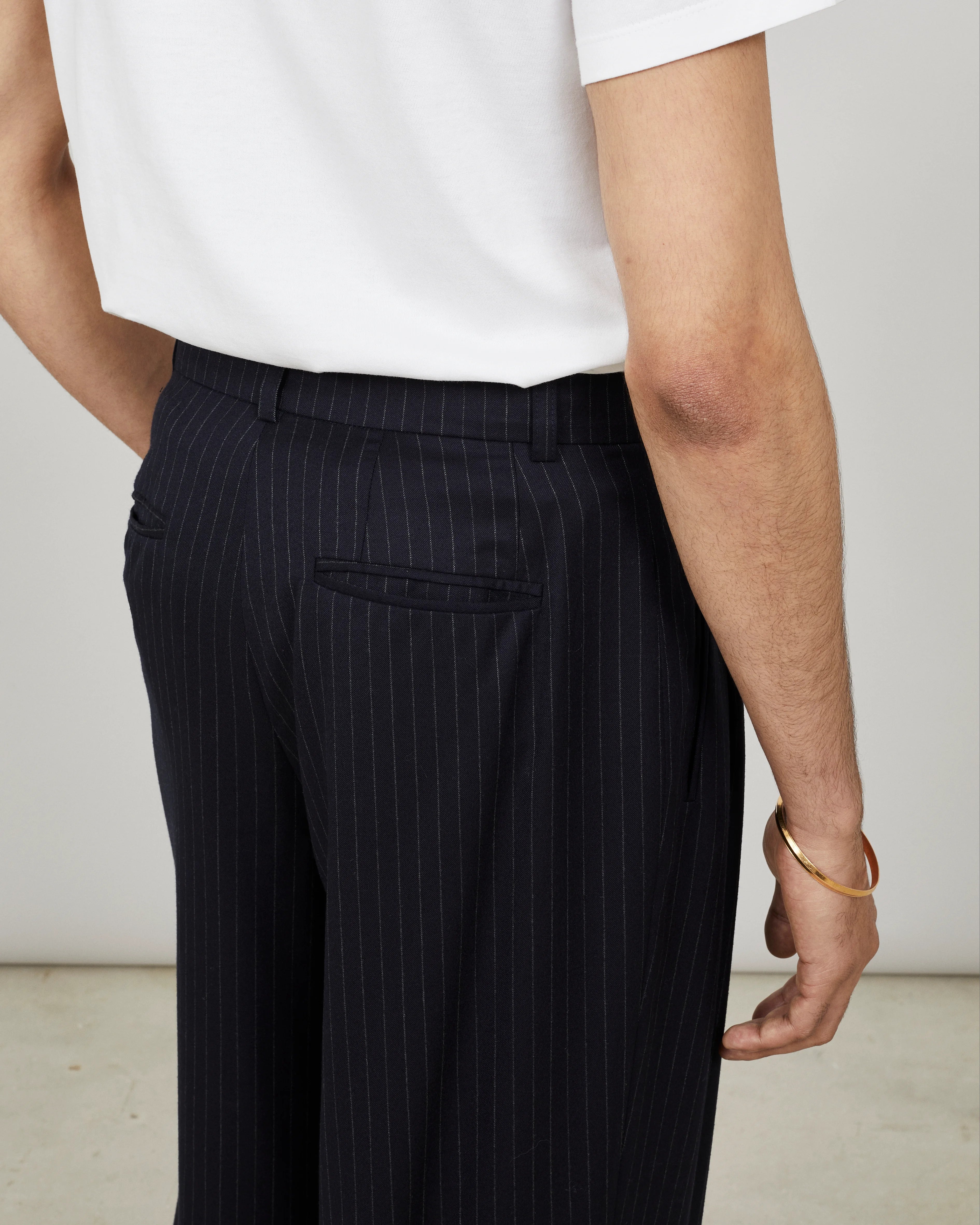 SOUTH - Wide-leg pleated trouser in pinstriped flannel