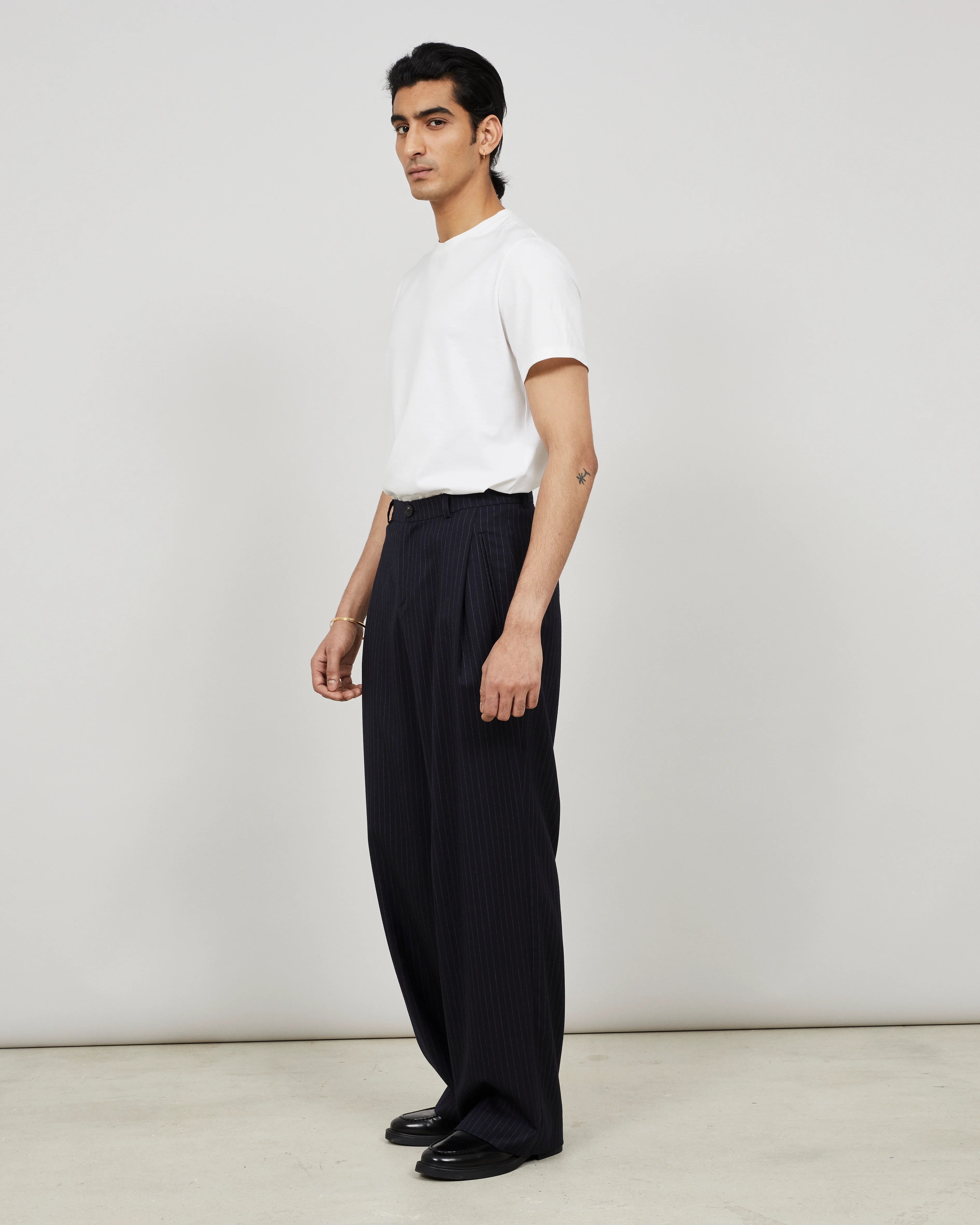 SOUTH - Wide-leg pleated trouser in pinstriped flannel